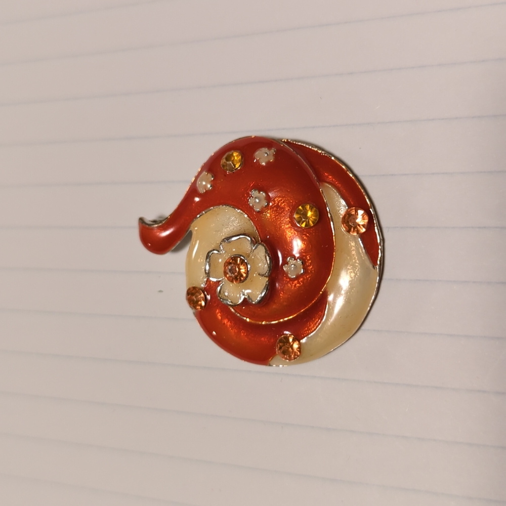 Orange and cream colored pendant.